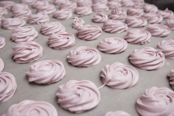 Marshmallow, Meringue, Zephyr over Baking Paper ready for Drying. Pink Dessert with Strawberry. Step by Step process.