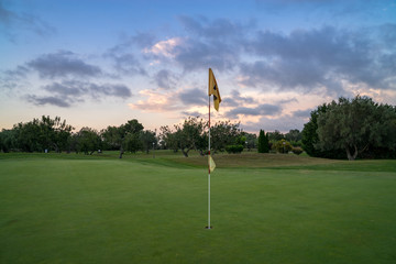 Obraz premium Golf green fairway blue cloudy summer sky in the background