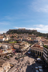 Obraz na płótnie Canvas View of Acropolis rock and Monastiraki square at Athens on blue sky background.