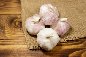 Bulbs of garlic on wooden table
