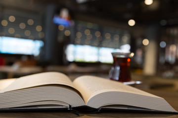 tea concept. tea and book on the wooden background. cafe concept.