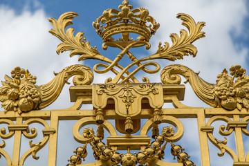 Fototapeta na wymiar Gold Filigree Gate at Palace of Versailles, France