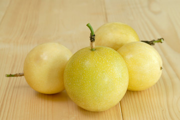 Passion Fruit on wooden floor,