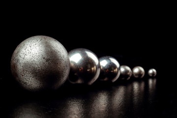 Metal balls on a black background.
