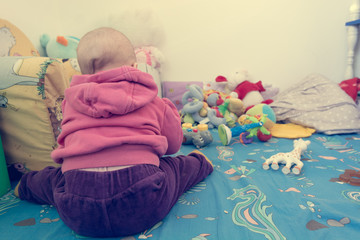 Baby playing with toys.
