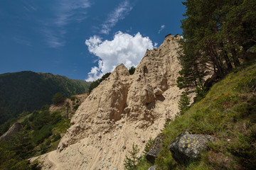 Movement of clouds and water flows in a stormy river in the Caucasus mountains in summer