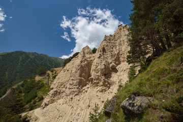 Movement of clouds and water flows in a stormy river in the Caucasus mountains in summer