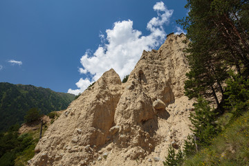 Movement of clouds and water flows in a stormy river in the Caucasus mountains in summer