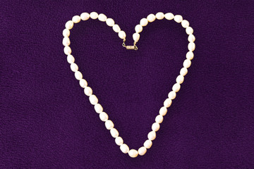 Women's jewelry made of pearls in the shape of a heart