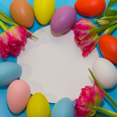 Colorful eggs on a blue background. Happy easter.