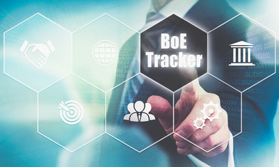 Businessman pressing a BoE Tracker business concept button.