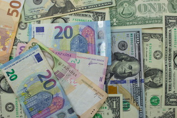 Fototapeta na wymiar American dollar banknotes and Euro. Background with money