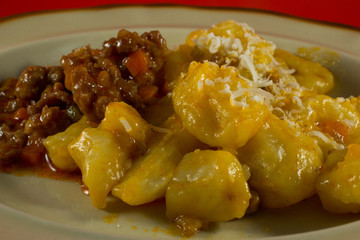 gnocchi with sausages sauce in the plate