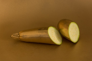 golden fruits and vegetables on a golden background