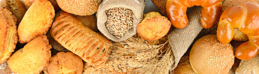 Panoramic background of bread made from wheat and rye flour.