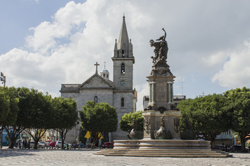 'S&atilde;o Sebasti&atilde;o' square and Church. Sunny day, blue sky with clouds. Manaus, Amazon / Brazil