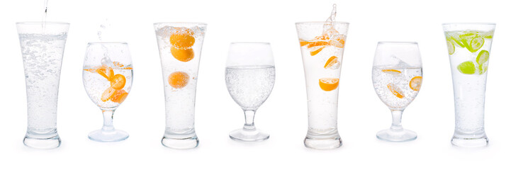 Glasses with sparkling water and citrus fruits set isolated with clipping path