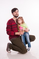 Father and daughter in the studio on a white background