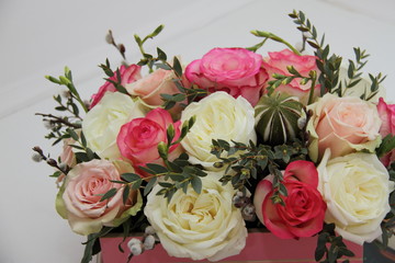 roses and exotic flower bouquet on white background, close 