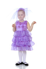 Little girl in purple dress.
