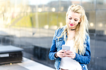 Young pretty woman with smartphone portrait