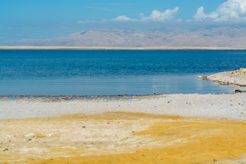 Sandy beaches of lowest salty lake in world below sea level Dead sea, Israel, landscape