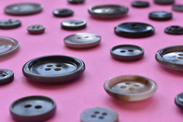 gray sewing buttons on pink