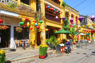 Sunny day at Hoian Ancient town, colourful houses. Colourful buildings with festive silk lanterns....