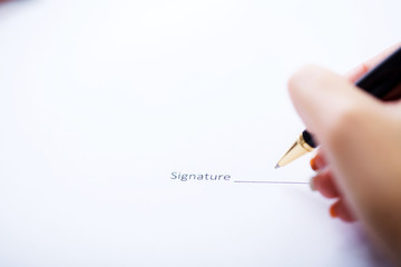 Business woman is signing a contract, business contract details