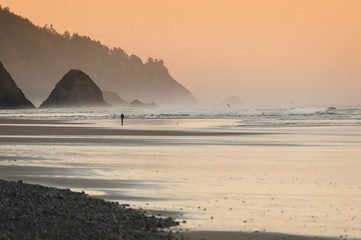 Beautiful Sunset at Cannon Beach, Oregon. The popular resort areas of Cannon Beach and Arch Cape...