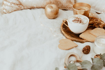 Good Morning. Cozy Still Life background with coffee cup and cookies on bed