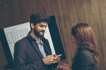Two business colleagues speaking
