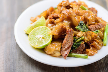 Thai food, stir fried rice noodles in soy sauce (Pad See Ew)