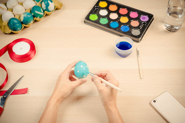 Happy easter, women is painting the easter eggs for easter day festival holiday, easter concept backgrounds with copy space