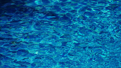 Pool water as background / Water is a transparent, tasteless, odorless, and nearly colorless chemical substance that is the main constituent of Earth's streams, lakes, and oceans, and the fluids of mo
