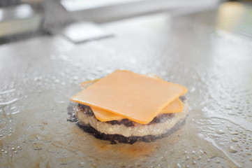 Fast food hamburgers take-away production cooking background