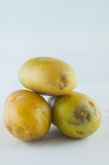 Isolated potatoes. Cut raw potato vegetables isolated on white background with clipping path


