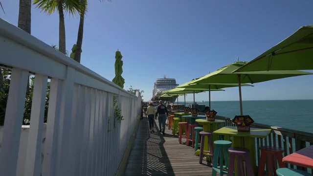 Outdoor restaurant on Mallory Square's shoreline