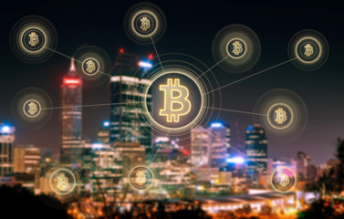 Bitcoins and blockchain network connection with blur Perth night city background .Electronic money ,blockchain transfers and finance concept.
