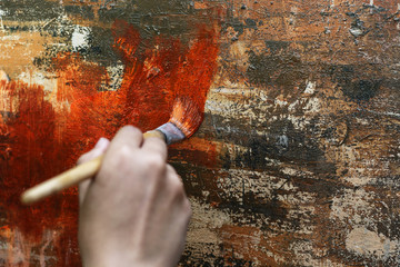 artist using a drawing brush.