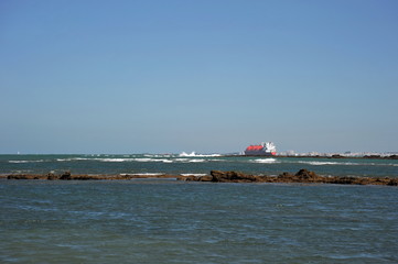 Fototapeta na wymiar Ships in the harbor of the seaport of Cadiz on the shores of the Cadiz Bay of the Atlantic Ocean.