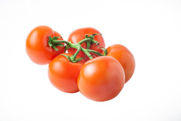 fresh tomatoes with green leaves isolated on white background