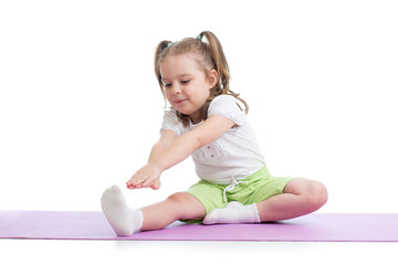 Obraz na płótnie Canvas Kid girl doing fitness exercises isolated on white
