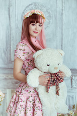 Beautiful young woman doll in pink dress in the room, with toys and plush bear, lolita. Japanese...