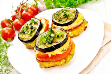 Appetizer of aubergines and cheese in plate on board