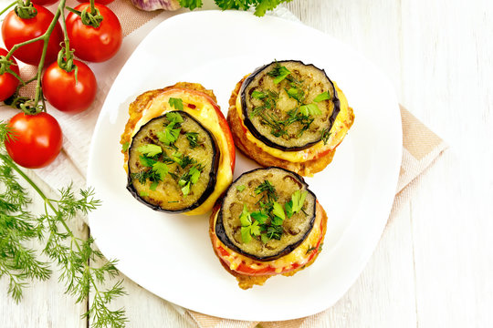 Appetizer of aubergines and cheese in plate on board top