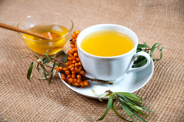 Sea buckthorn tea with a on white background