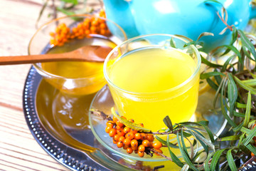 Sea buckthorn tea with a on white background