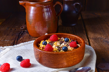 rustic muesli breakfast with forest fruits