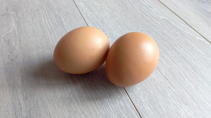 Eggs chicken close-up on a light gray table on the laminate